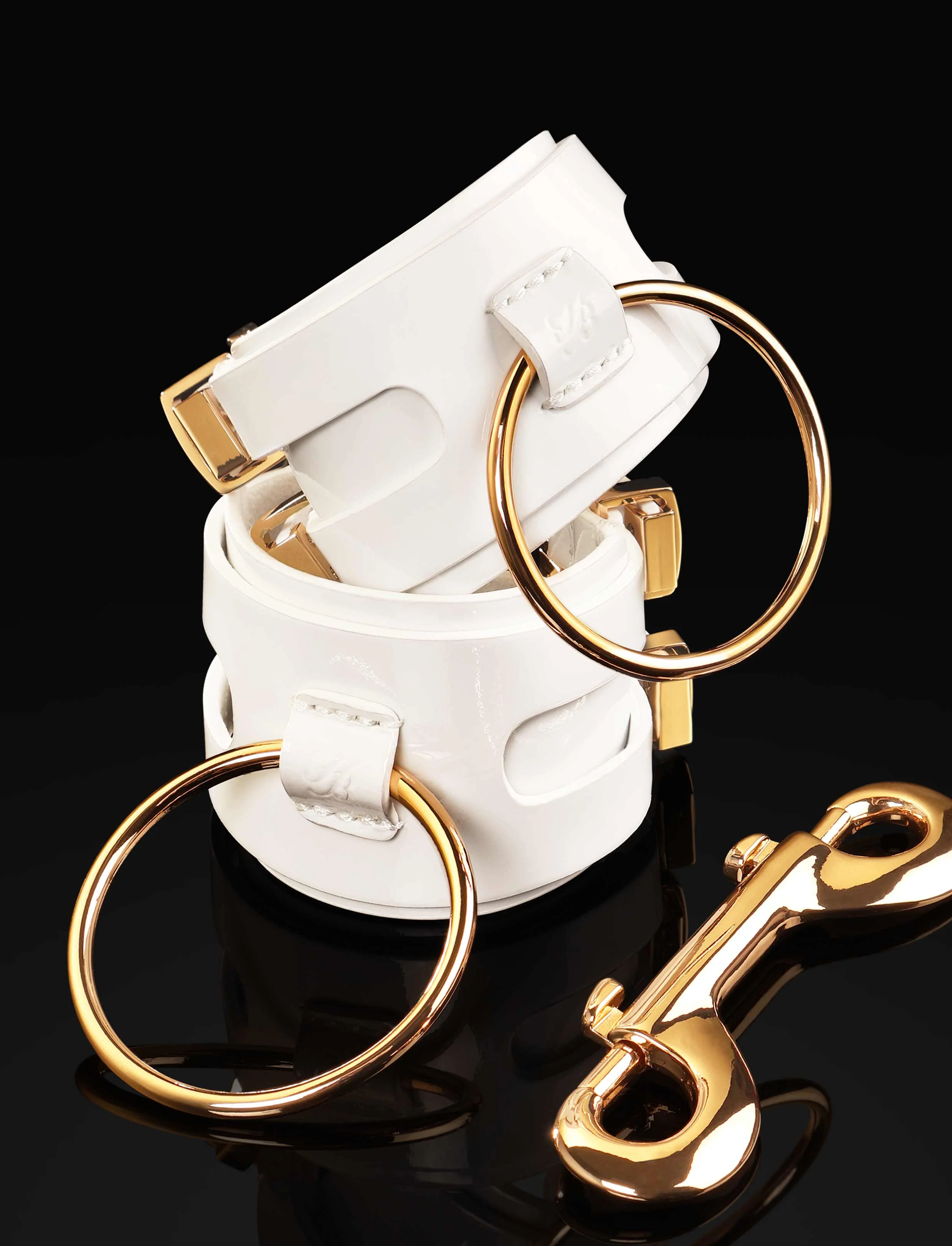 Jasmin White Wrist Cuffs in Patent Leather with Large O Rings